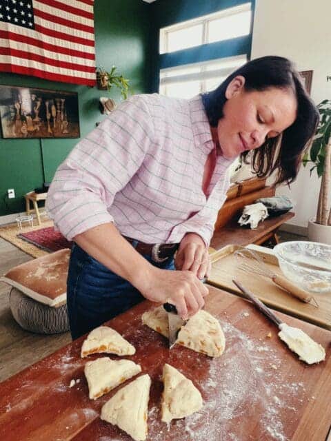 cutting scones into triangle to bake