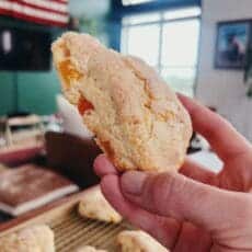 close up of freshly baked apricot ginger scones, with fruit showing through the fluffy dough