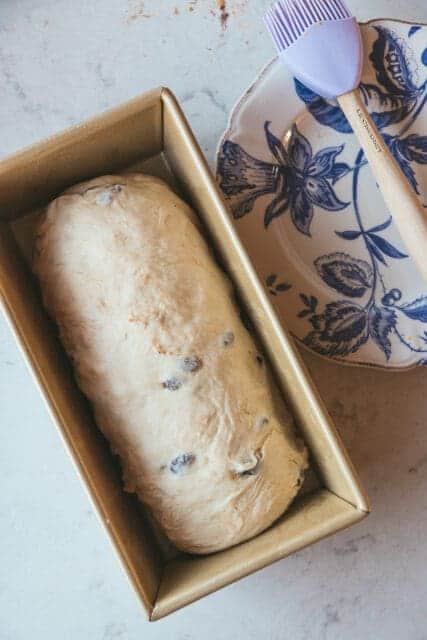 cinnamon raisin swirl dough ready to be baked in a loaf pan