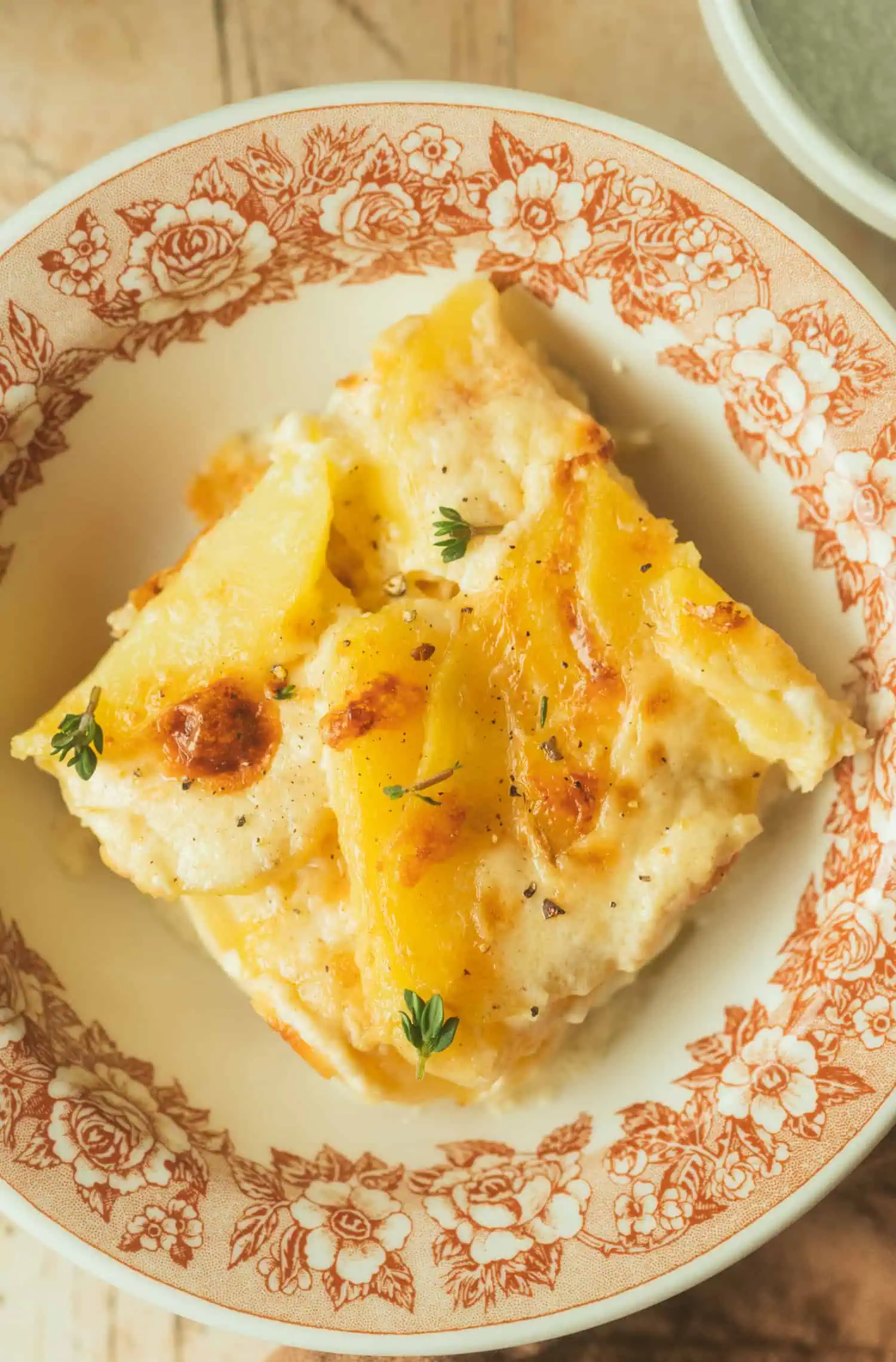 a slice of dauphinoise potatoes on a plate
