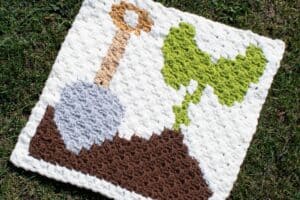 Garden tool and plant design rug for outdoor decor.