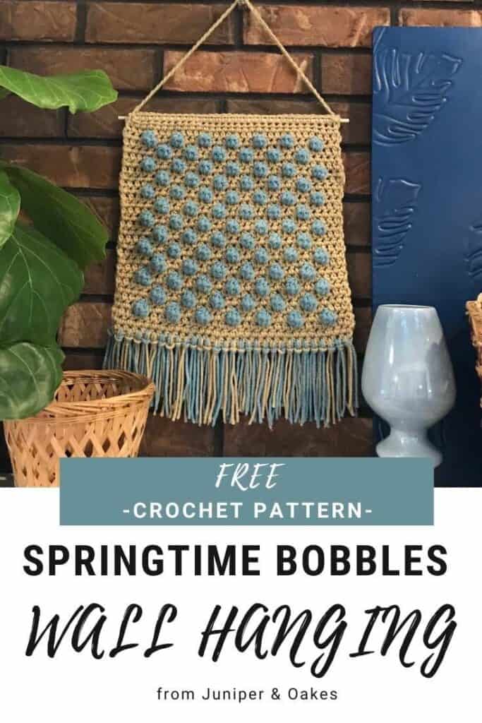 Wall decor featuring colorful crochet bobbles for spring.
