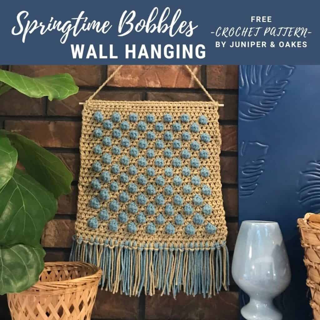Wall Hanging with Blue Bobble Pattern by Juniper & Oakes.