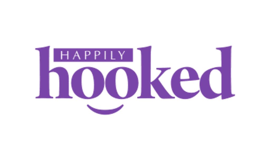 Logo of Happily Hooked with purple text and smiley face design.