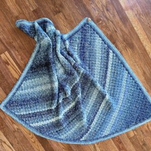 Ombre baby blanket with a soft blue gradient, perfect for a baby shower gift or nursery decor.