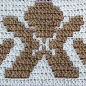Crochet gingerbread man motif perfect for festive blanket projects and seasonal crafts.