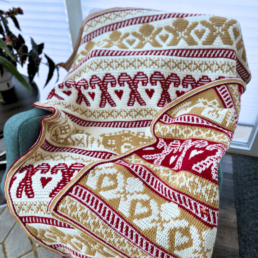 Gingerbread Mosaic Blanket draped over a chair