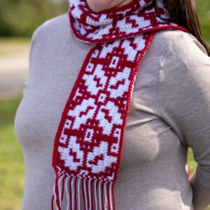Festive red and white mosaic crochet scarf with intricate holiday design, perfect for Christmas cele.