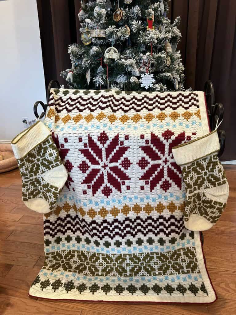 Decorative Nordic star crochet blanket with festive holiday stockings. Perfect for winter decor and.