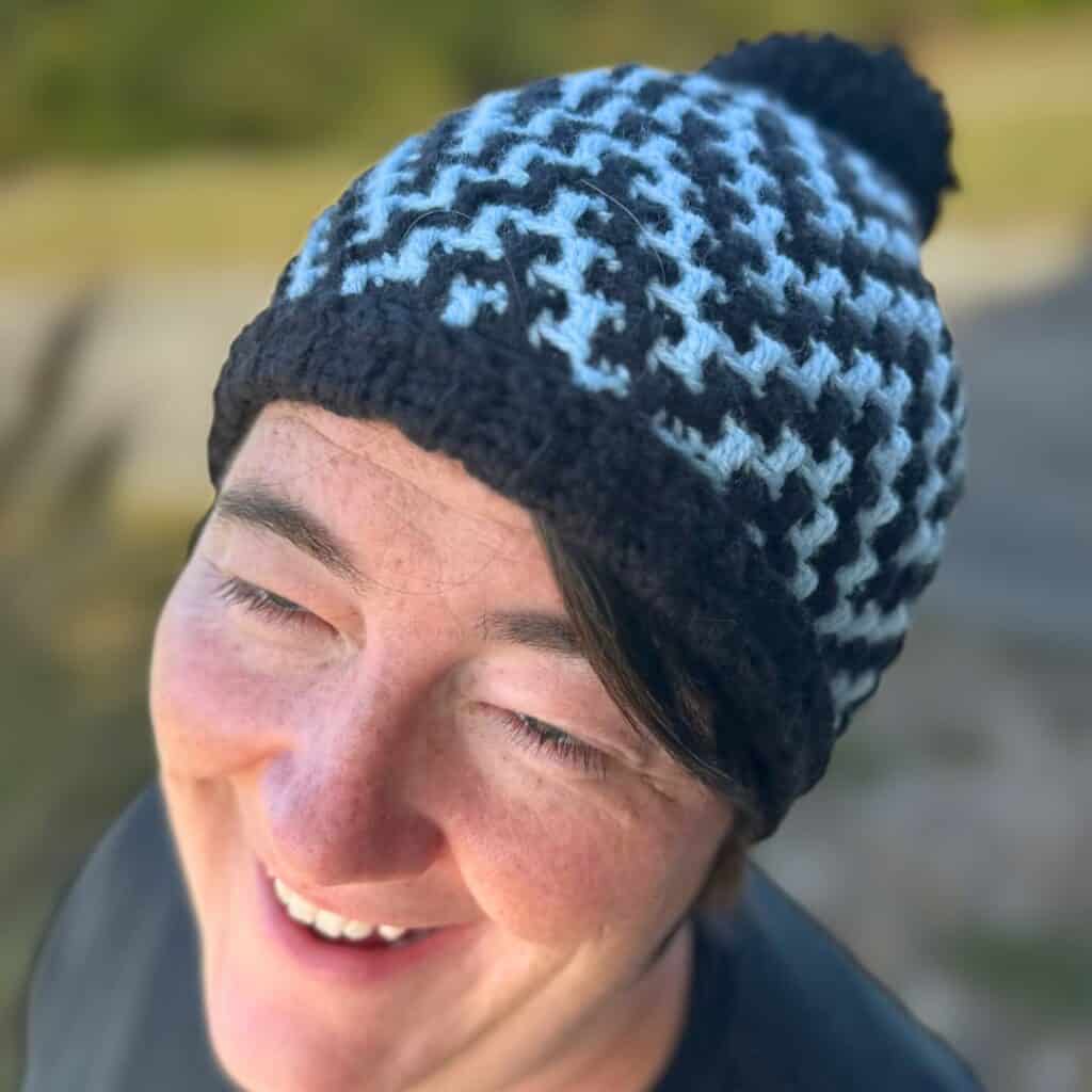 ZigZag crochet hat in blue and black, perfect for winter warmth and style. Handmade with a cozy, tex.