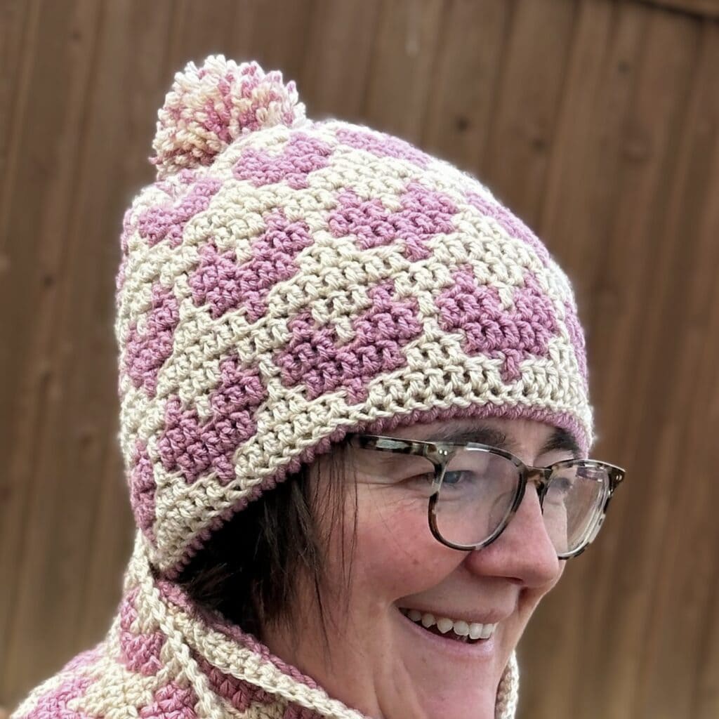 Beautiful handmade mosaic hearts crochet hat in pink and cream. Perfect for winter warmth and stylis.