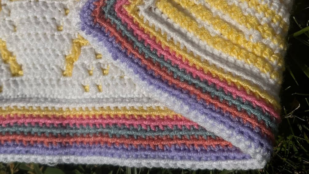 Colorful striped envelope border for a mosaic crochet blanket