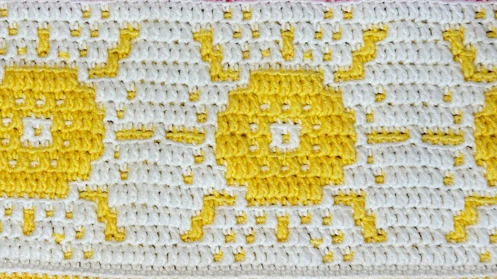 Vibrant yellow and white crochet sunshine mosaic pattern for summer blankets.