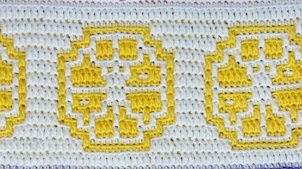 Crocheted summer mosaic blanket strip with yellow and white lemon slices