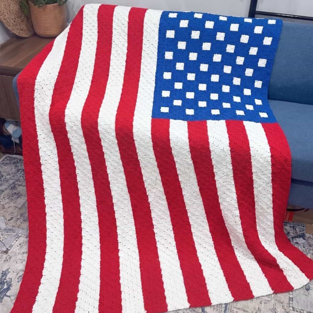 American flag crochet blanket with red, white, and blue stripes and stars.