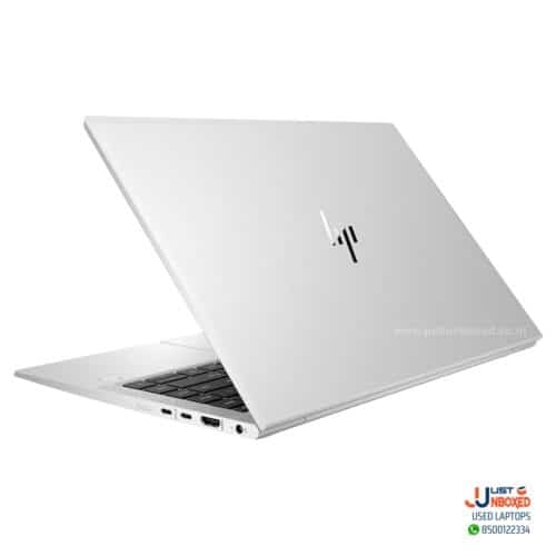 Laptop with silver exterior and HP logo, side ports visible, modern design for professional use.