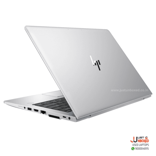 1. Silver HP laptop with sleek design, open view showing ports and keyboard.