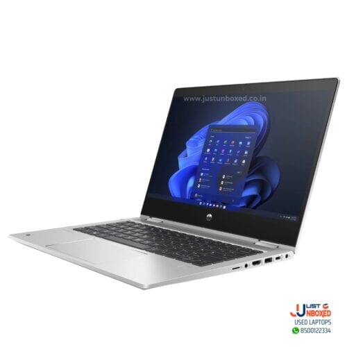 Dell silver laptop with Windows 11 interface and multiple connectivity ports.