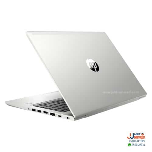 Laptop with silver body and HP logo, port options visible on side.