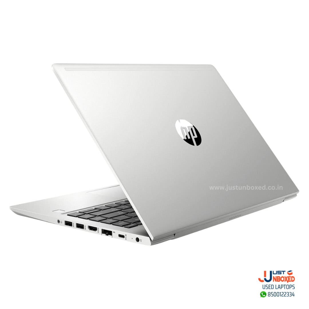 Laptop with silver body and HP logo, port options visible on side.