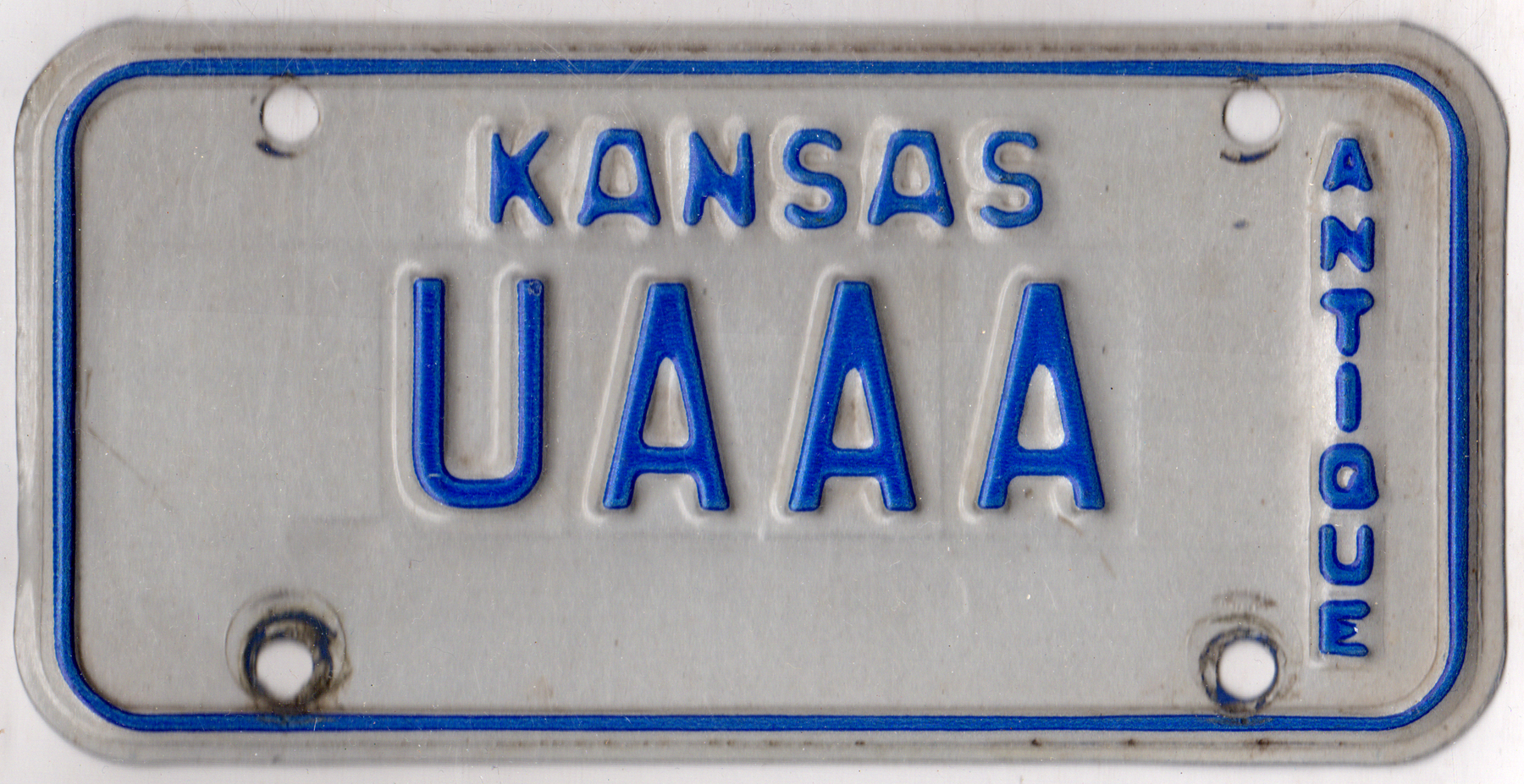 Kansas antique motorcycle license plate #UAAA