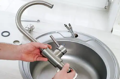Plumber-Installing-A-Faucet