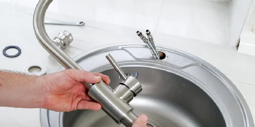 Plumber-Installing-A-Faucet