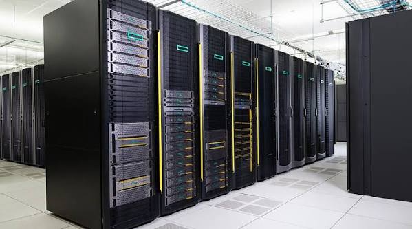 Row of high-capacity data center servers in a modern server room.
