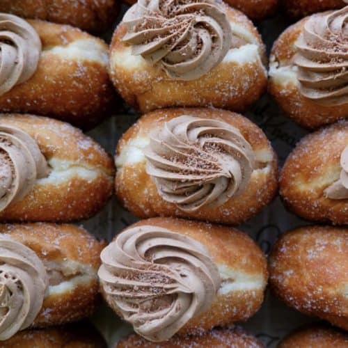 Delicious glazed donuts with chocolate frosting in New Zealand. Perfect for breakfast or treats.