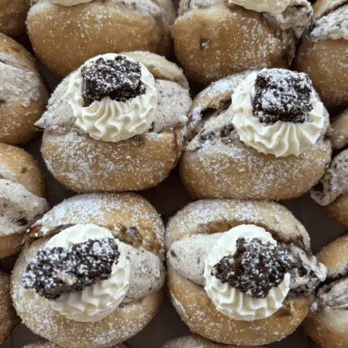 Delicious NZ donuts with cream and cookie toppings. Perfect sweet treats by Knead Donuts.