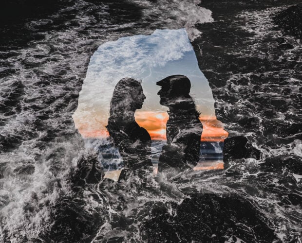 A double exposure of a bride and groom's silhouette during their Tunnel Beach Elopement on the Oregon Coast.