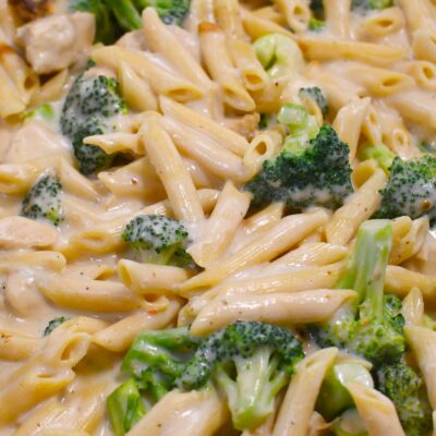 Creamy chicken broccoli ziti Alfredo pasta close-up image.