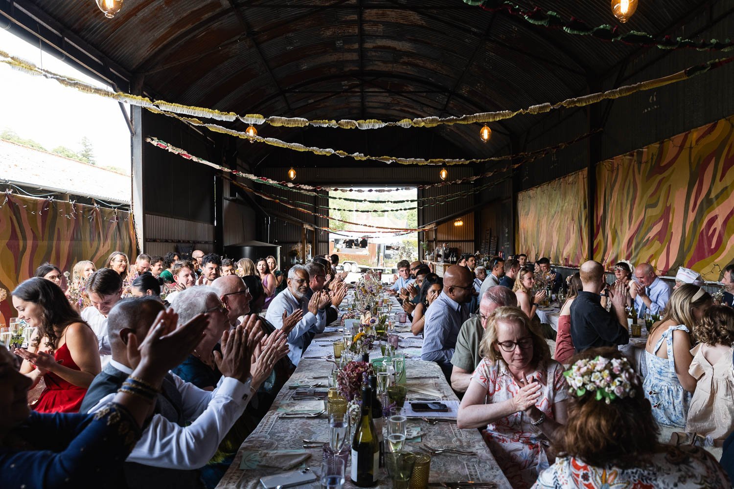Photography of a yellow DIY wedding in a barn by London photographer Lauren Squire