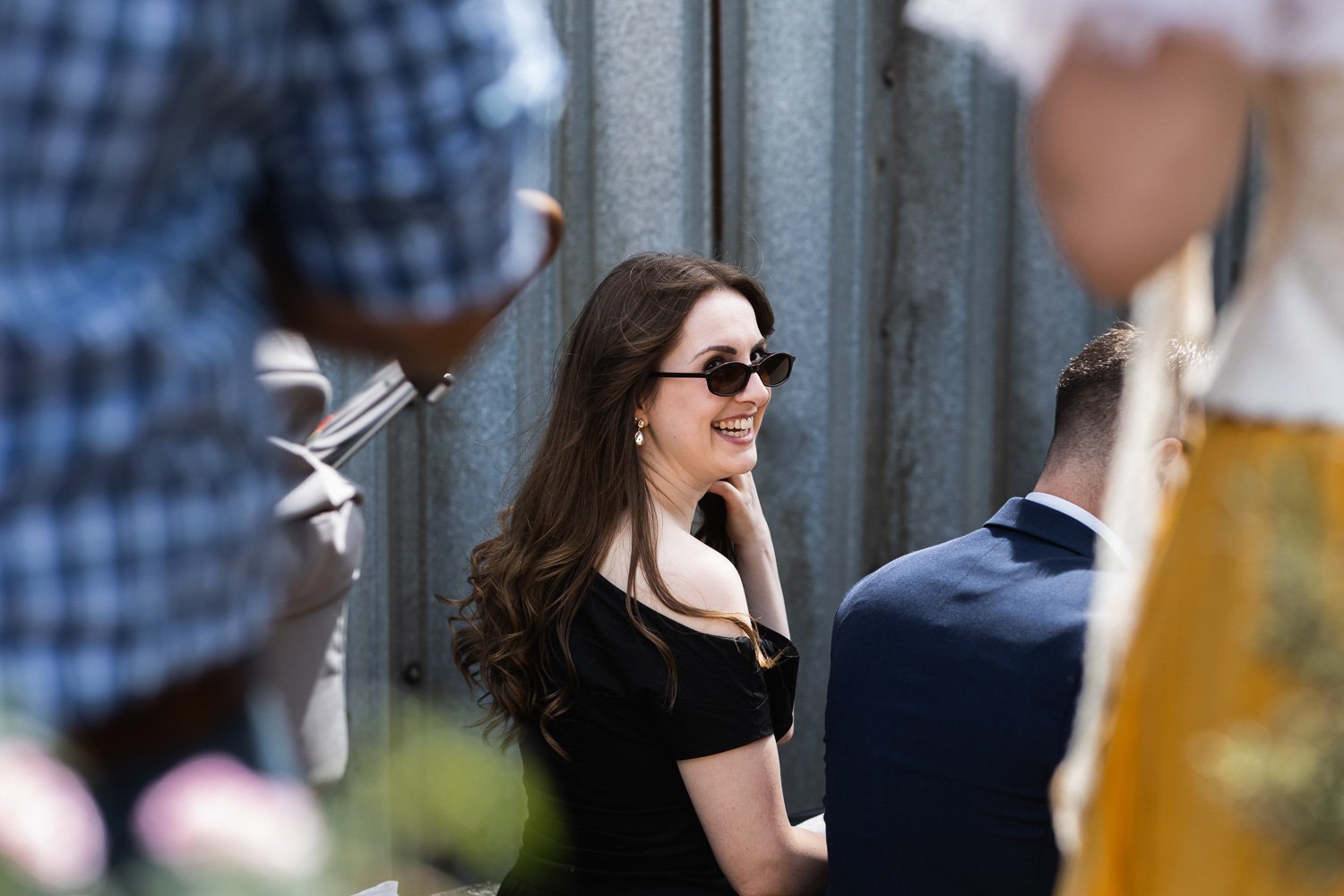 Photography of a yellow DIY wedding in a barn by London photographer Lauren Squire