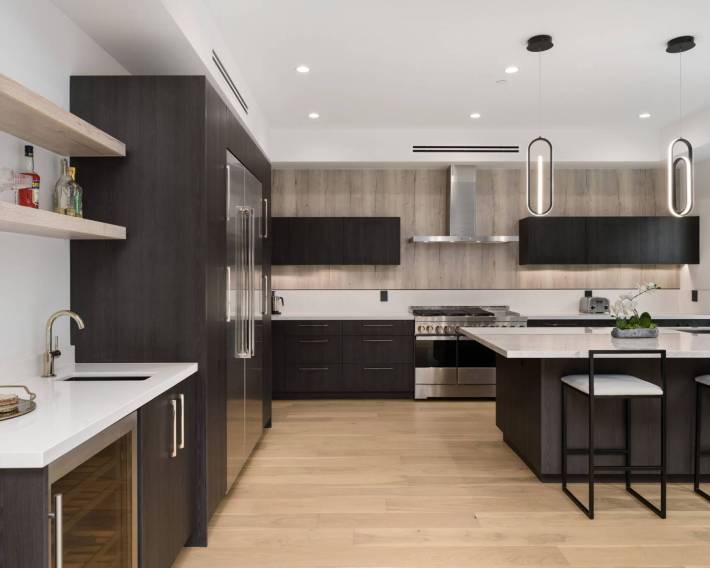 Modern kitchen with two bar stools at the counter