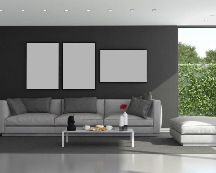 Black and gray modern living room with large windows and garden on background - 3d rendering