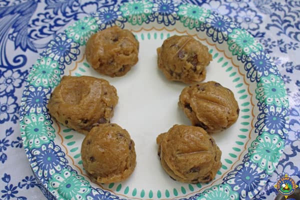 6 scoops of cookie dough on a paper plate