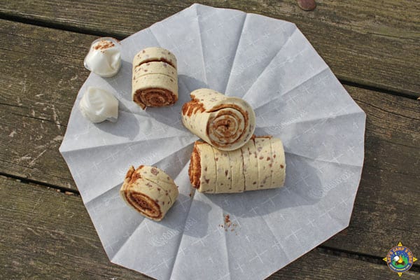 raw cinnamon rolls on parchment