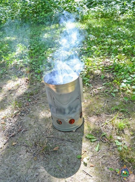 charcoal being prepared in a charcoal chimney