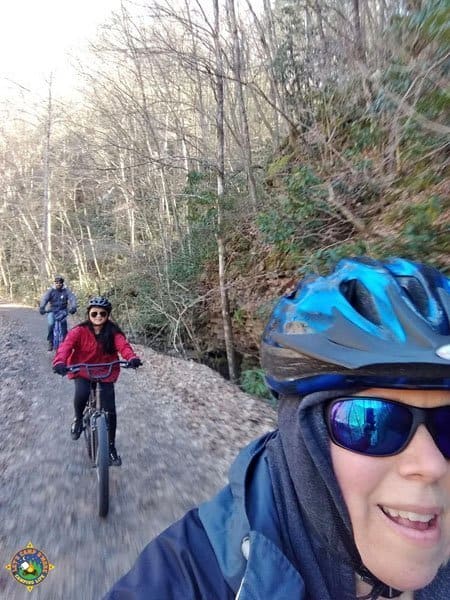 Family riding on the Virginia Creeper Trail family of 3 riding down a trail