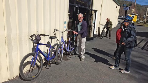 Bike Rental Return woman returning at rental bicycle