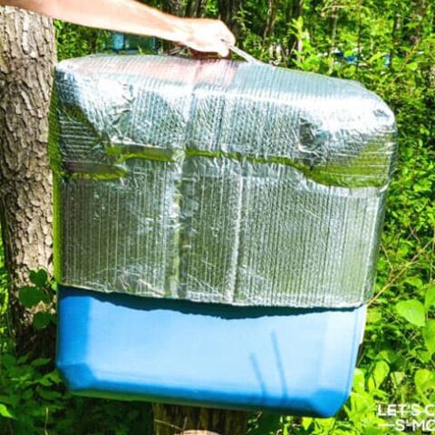 insulated cover being pulled off an ice chest