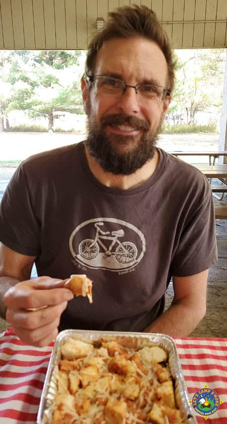 man eating pizza pull apart bread