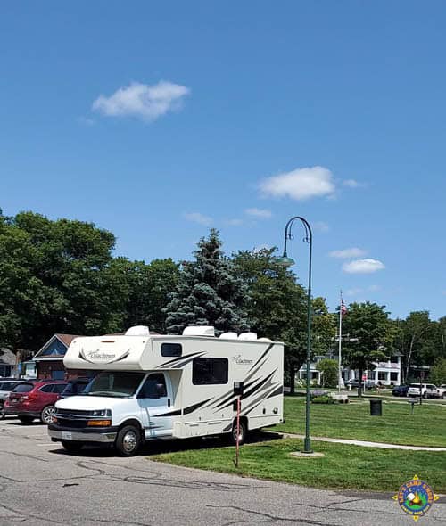 small motorhome parked in a regular parking space