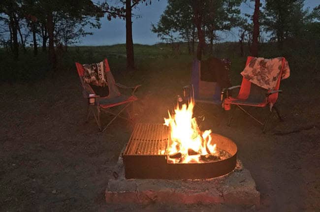 campsite with a campfire burning near Lake Michigan at Illinois Beach State Park