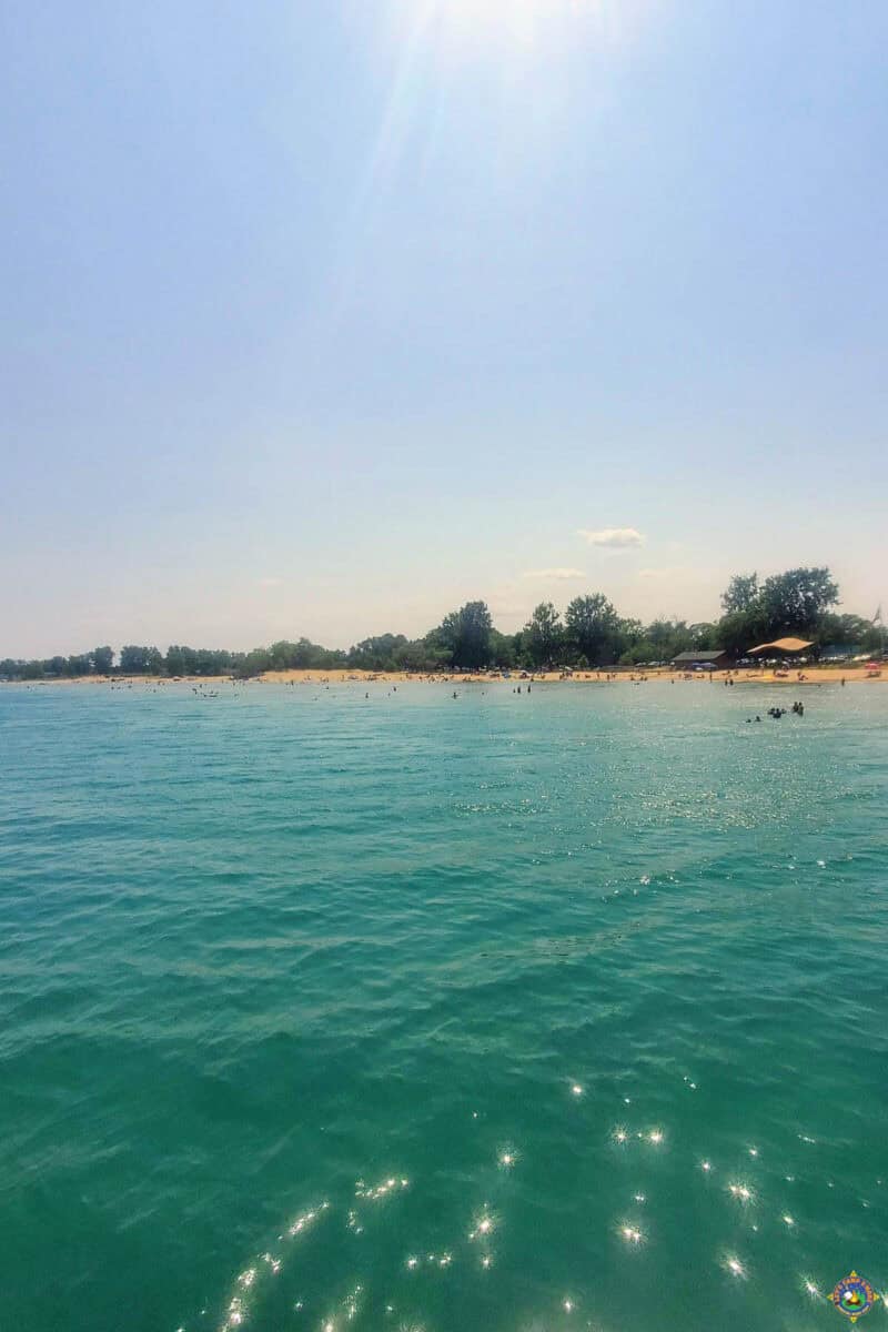 a view of the beach at Harrisville State Park as seen from the lake
