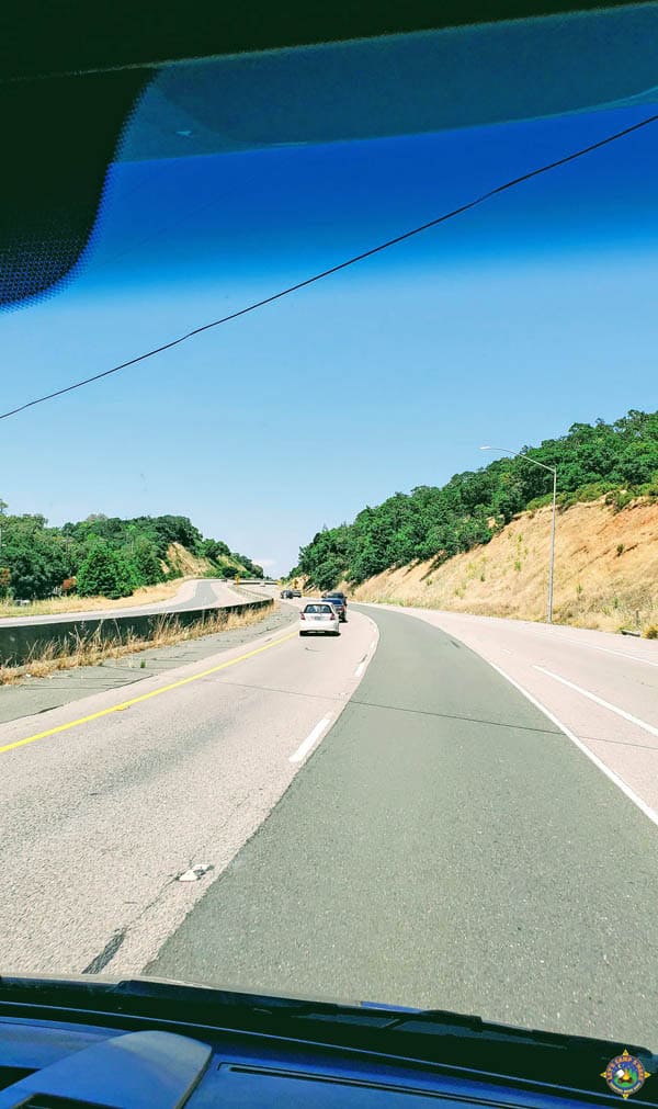cars going up a hill on I-5 in California