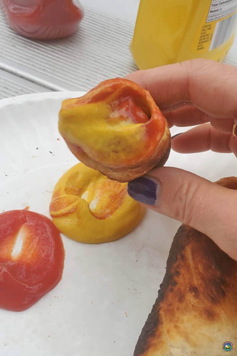 Pigs in a Blanket with mustard and ketchup