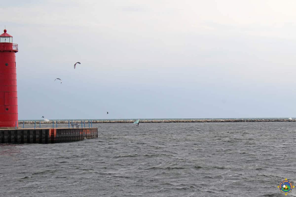 Muskegon Lighthouse with kite surfers and wind surfer