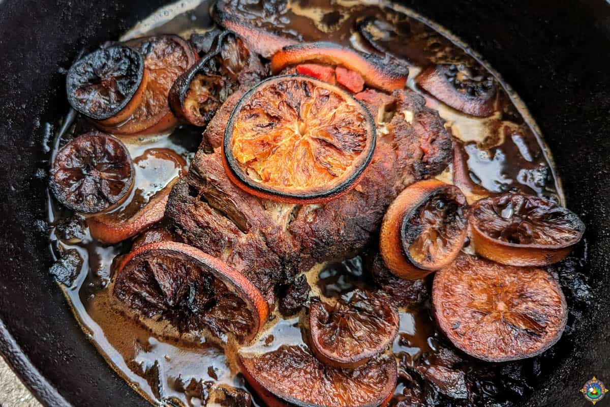 Pork Carnitas in a Dutch Oven with Citrus slices